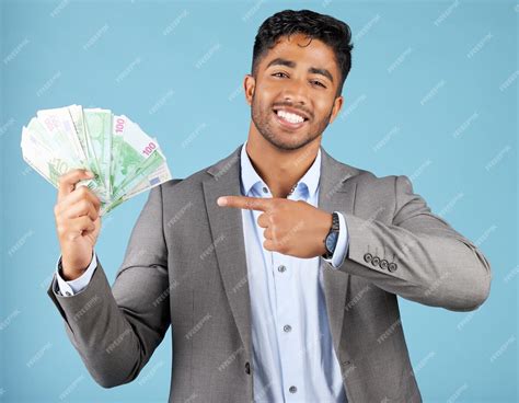 Premium Photo | Man cash and hand in portrait at studio for winning success and profit with ...