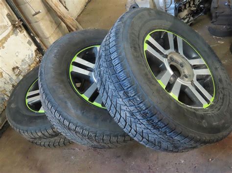 3 Michelin 275/65R18 tires on 6 bolt rims - Schmalz Auctions