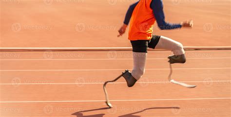 Asian para-athlete runner prosthetic leg on the track alone outside on ...