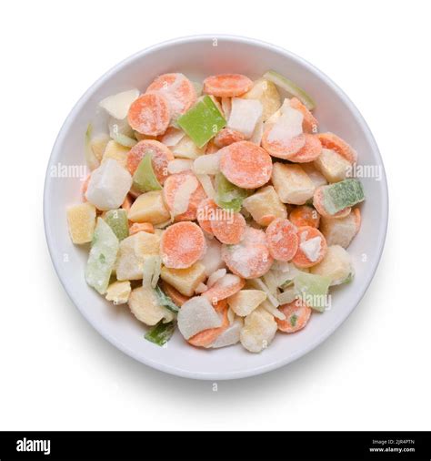 Bowl of frozen mixed vegetables shot from above isolated on white with ...