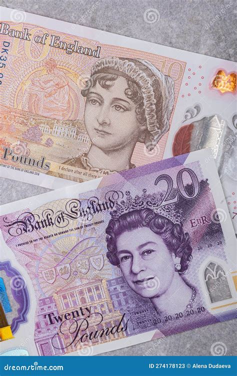 Banknotes In Denominations And 20 With A Portrait Of Queen Elizabeth On A Gray Background ...