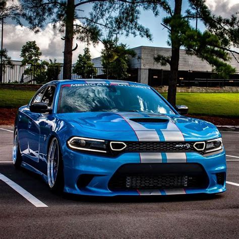 Blue Dodge Charger parked in a parking lot