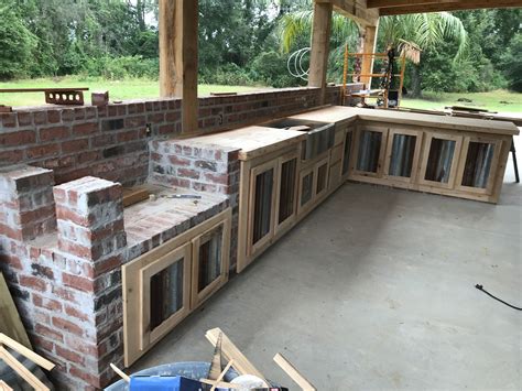 Rustic Outdoor Kitchen with Brick BBQ Pit Stand