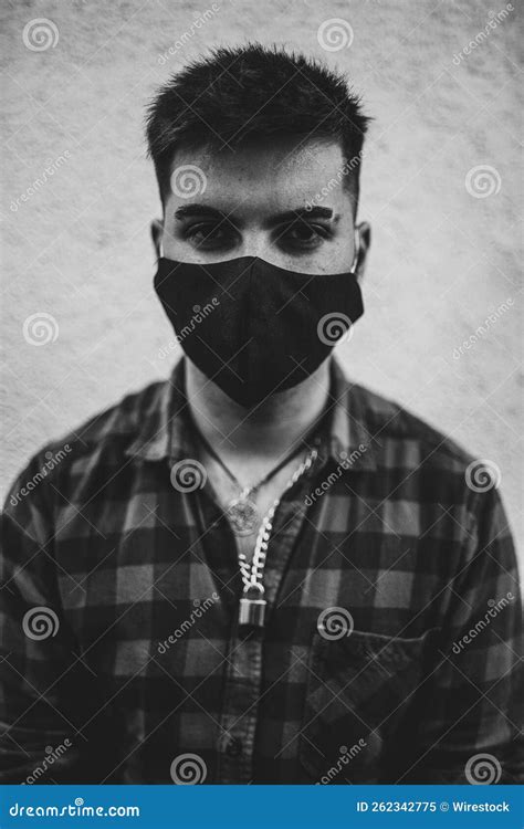 Vertical Grayscale Shot of a Young Spanish Man Wearing a Face Mask ...