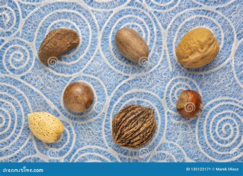 Variety of nuts in shells stock image. Image of pattern - 135122171