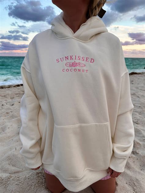 Ivory and Hibiscus Pink Sunkissedcoconut Logo Embroider Hoodie | Cutie ...