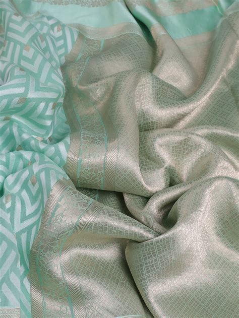 Teal Green Banarasi Kora Saree With Allover Thread Weaves And Satin Bo ...