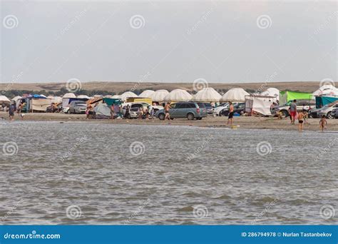Rest on Lake Shalkar. People and Kazakh Yurts on the Lake. Beach ...