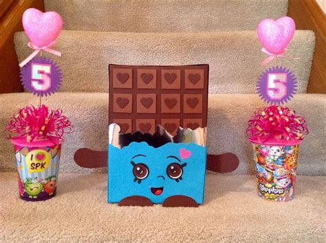 Shopkins centerpiece. Cups, bows & Valentine wands purchased from ...