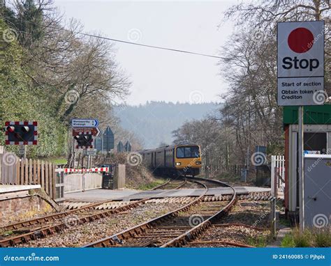 Train Approaching a Level Crossing in Devon UK Editorial Image - Image ...