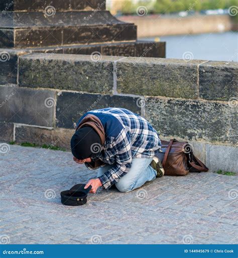 Cold Homeless Man on His Knees Begging for Money from Tourists on the ...