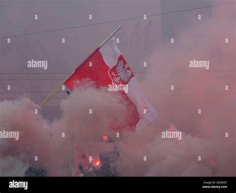 Polish banner shrouded in smoke. Independence day, Poland, 11.11.2022 ...