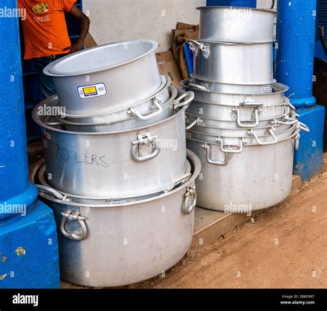 Oversized aluminium cooking pots in a shop in the town of Voi in ...