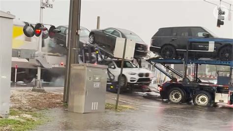 Train crashes into car hauler stuck on tracks in Florida