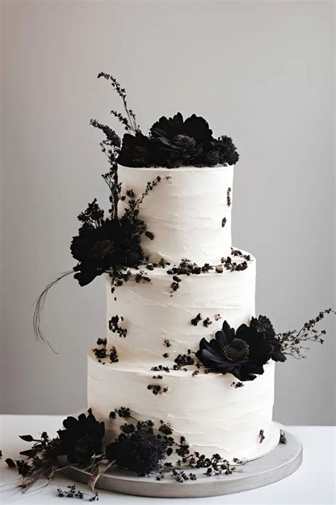 White wedding cake with black dried flowers | Black wedding themes ...