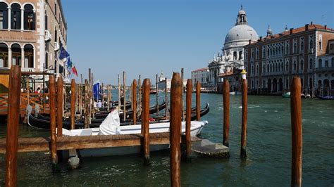 Parking spaces on the grand canal with water in Venice free image download