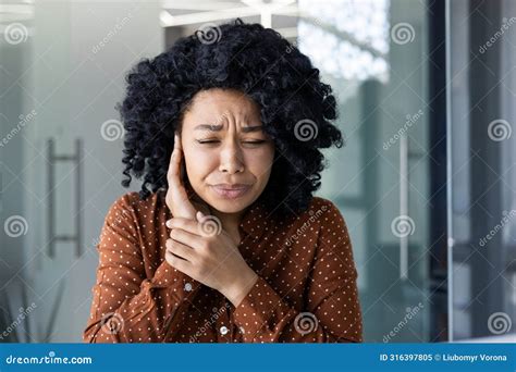 Young Woman Feeling Severe Ear Pain in a Modern Office Stock Image - Image of corporate ...