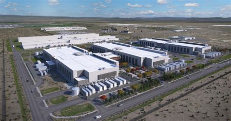 Aerial view of a modern industrial complex featuring large buildings, solar panels, and landscaped areas, representing managed IT services infrastructure in Pennsylvania.