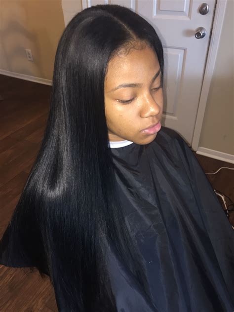 Bone straight Brazilian weave. Middle part sleek sew-in weave ...