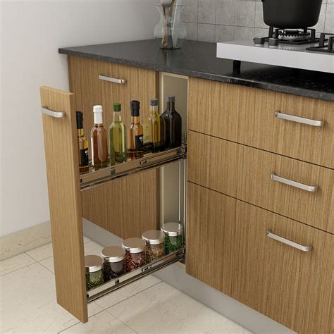 An L-Shaped Kitchen Finished In Natural Teak With Frosted Glass Shutte ...
