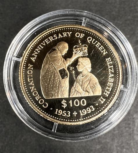 A proof 1993 QEII Coronation commemorative 100 dollar coin, 585, weight ...