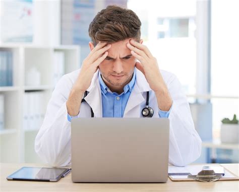 Stress anxiety or burnout for doctor with laptop working on medicine ...