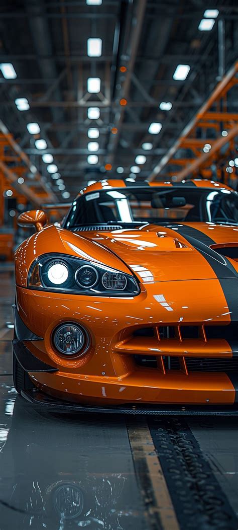 Twin Orange Sports Cars in a Garage