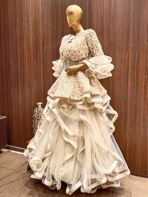 Gold Flared Net Gown with Ribbon Embroidery & Ruffles And Layering ...