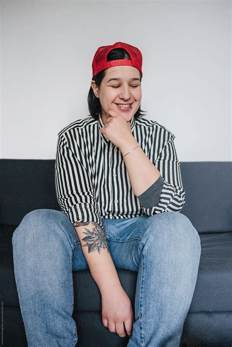 Portrait Of A Tomboy Smiling At Home - Stock Image - Everypixel