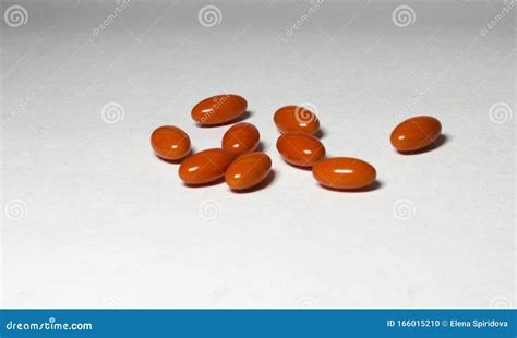 Closeup Orange Oblong Pills on White Light Table Background Stock Photo ...