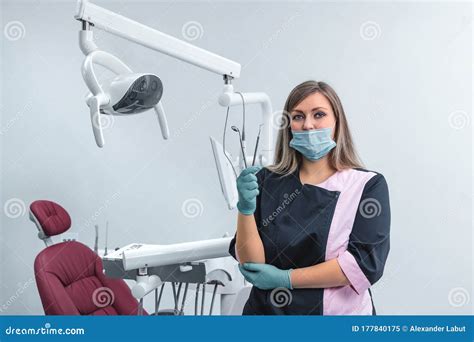 Beautiful Female Dentist Standing in the Dentistry Near Dental Unit ...