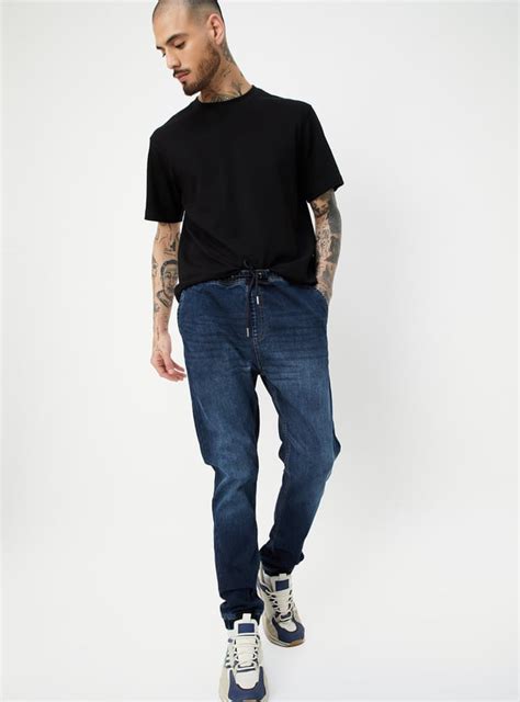 Buy Men Washed Carrot Fit Jogger Jeans Online at just Rs. 1299.0 ...