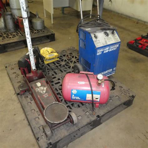 Lot #107 - Floor Jack, Napa 5 Gallon Air Tank, Battery Chargers & Cord ...