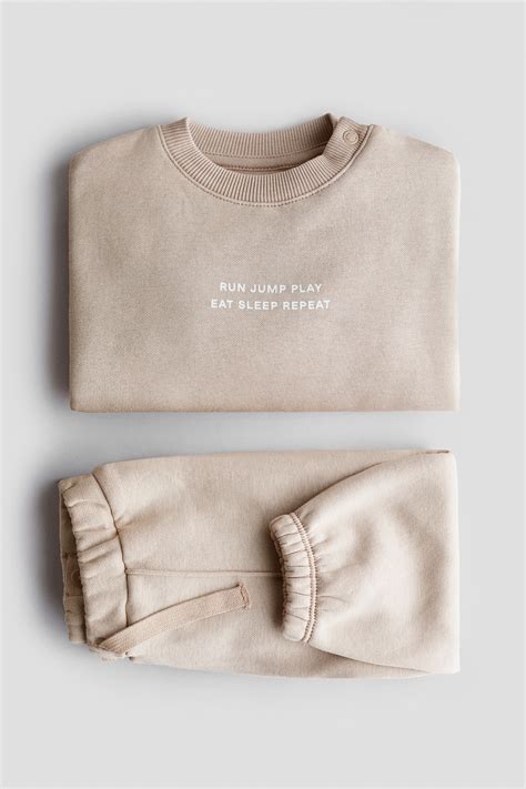 2-piece printed sweatshirt set - Light beige/Run Jump Play - Kids | H&M IN