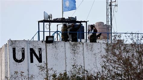 FILE PHOTO: United Nations peacekeepers (UNIFIL) and Lebanese army soldiers stand guard at a checkpoint in Naqoura, near the Lebanese-Israeli border, southern Lebanon, October 27, 2022. REUTERS/Aziz Taher/File Photo