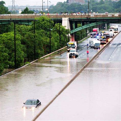 Car is stuck during flood on the Don Valley Parkway, a major highway ...
