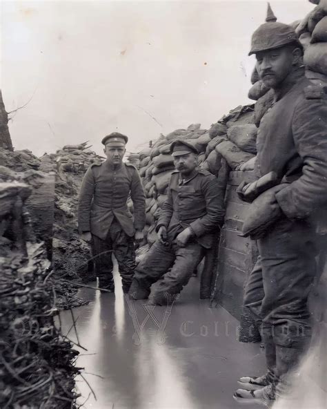 German soldiers posing for a photograph in a flooded trench, ca. 1915 ...
