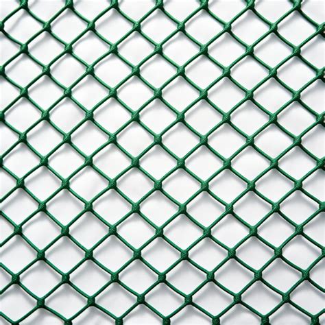 A close up of a green chain link fence with a white background ...