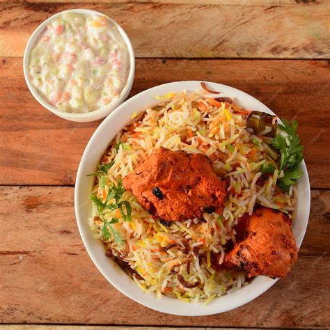 Premium Photo | Chicken tikka biryani made of basmati rice cooked with ...