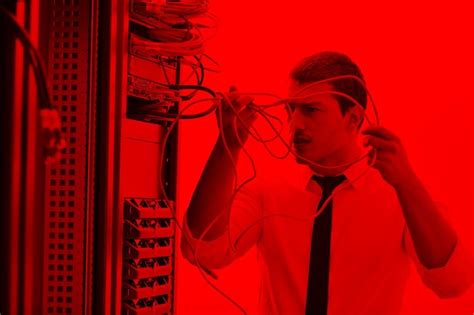 Young engeneer in datacenter server room | Premium Photo