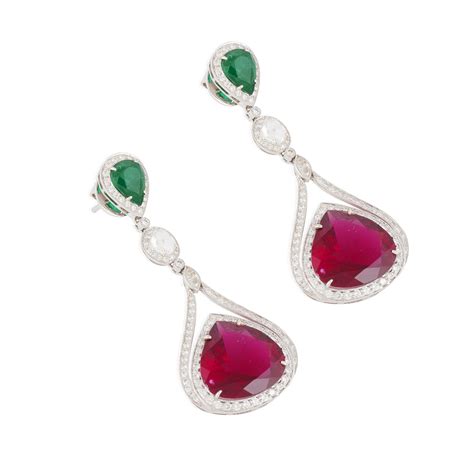 A simple yet elegant pair of rubellite, emerald and diamond ear ...