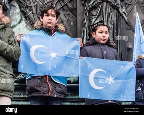 Munich, Bavaria, Germany. 2nd Feb, 2019. Uyghur children in Germany protesting with the flag of ...