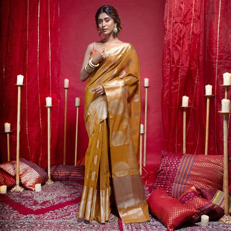 Banarasi kora cotton saree in mustard yellow color with zari motifs an ...