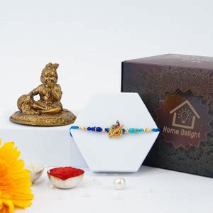 Home Delight Thread Designer Rakhi With Laddu Gopal Golden Statue of ...