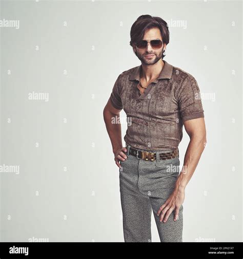 Im kind of a big deal...A handsome man in retro 70s clothing striking a ...