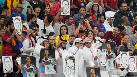 Qatar fans hit back at Germany's mouth covering protest with Mesut Ozil ...