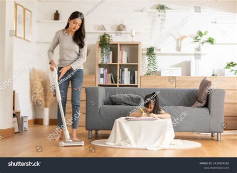 Asian Mother Vacuuming Floor While Little Stock Photo 2435824565 ...