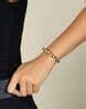 Buy Isharya Women Brass Bracelet | Black Color Women | AJIO LUXE