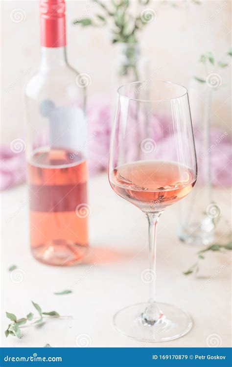Glass and Bottle of Rose Wine Stock Image - Image of board, garden ...