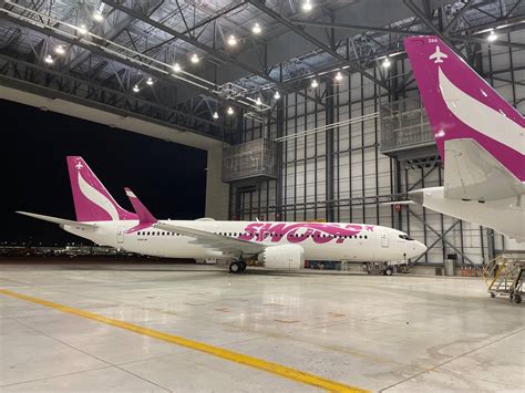 Download Swoop Airplane In A Hangar Wallpaper | Wallpapers.com